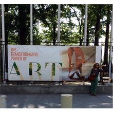 Nina Muzzi , artist,  in front of the banner " The transformative Power of Art" United Nations Visitors Lobby; New York. June 2015